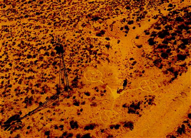 Roswell, New Mexico 105 Isobel in Desert with Alien Symbol