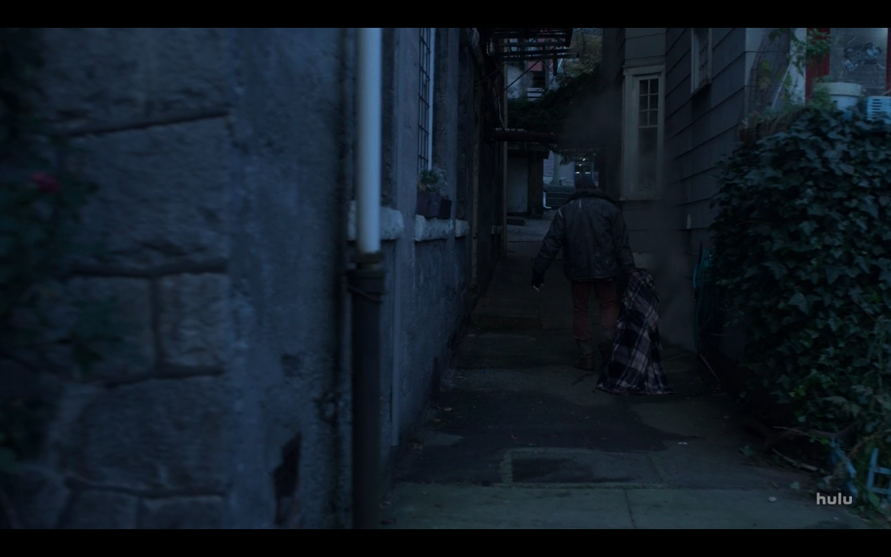 Helstrom S1Ep2 Man Drags Checked Blanket in Alley
