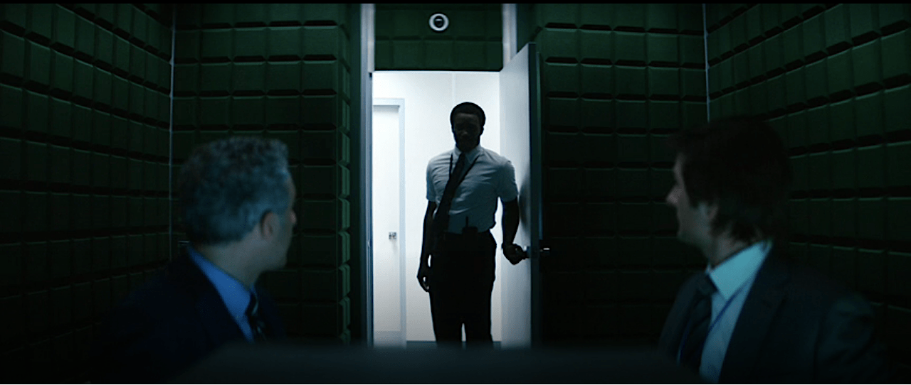 Severance S1Ep1 Milchick Looms in Observation Room Door