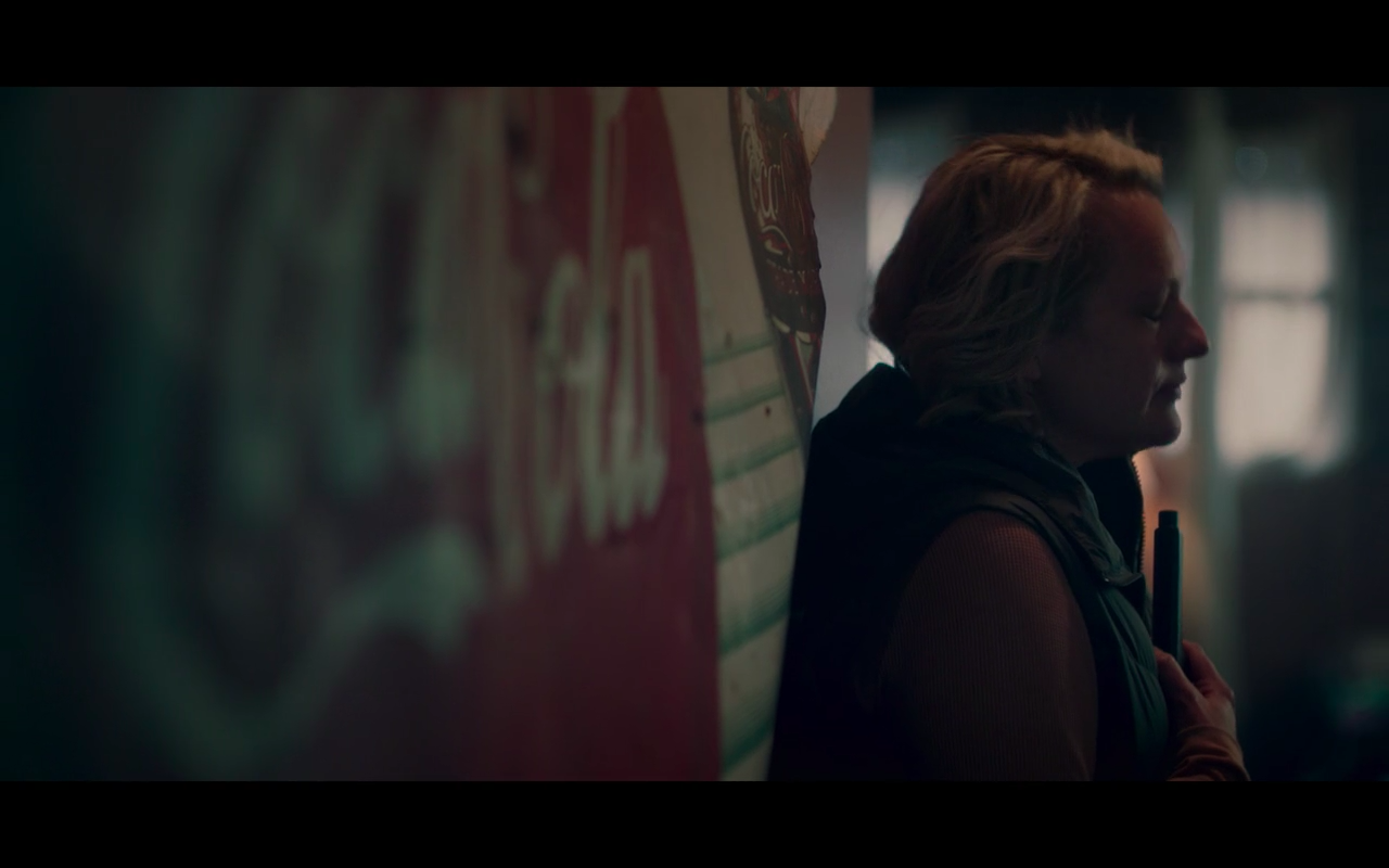 Handmaid's Tale S5Ep3 June Finishes Phone Call with Nick- American Coke Symbol Stands Between Them